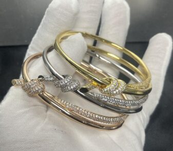 The iconic Tiffany & Co. Knot bracelets—a symbol of connection and strength in rose gold.