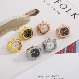 A chic and vintage-inspired watch ring with a cushion-shaped face and a simple metal band.  Description